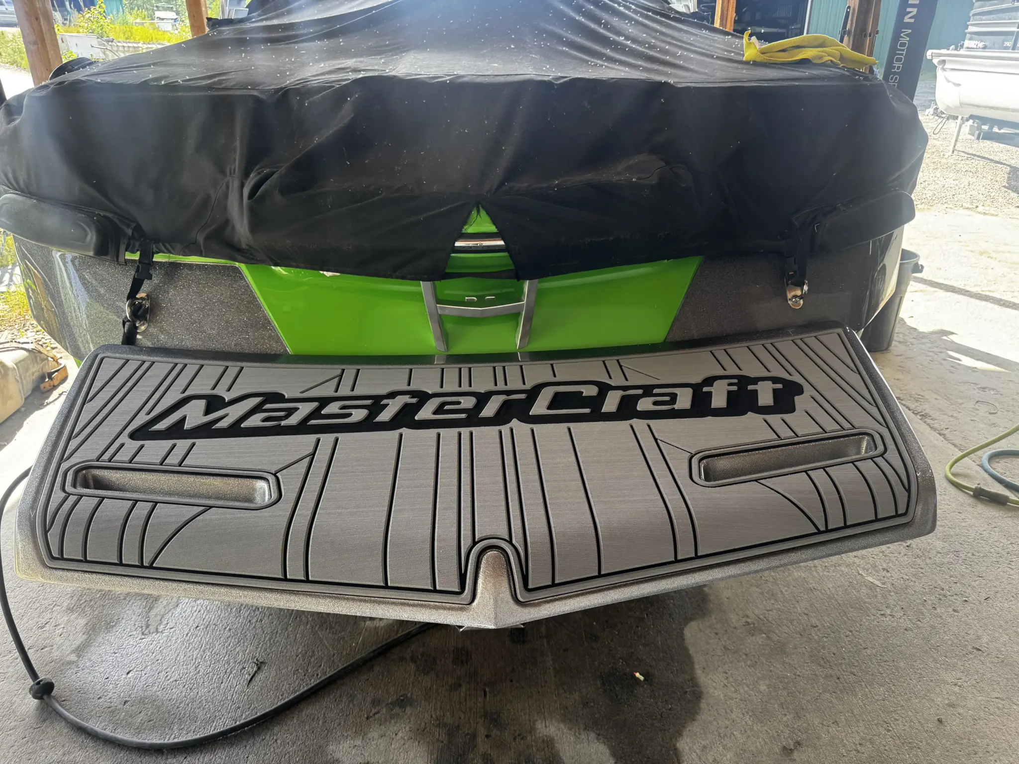MasterCraft boat with covered seating area.