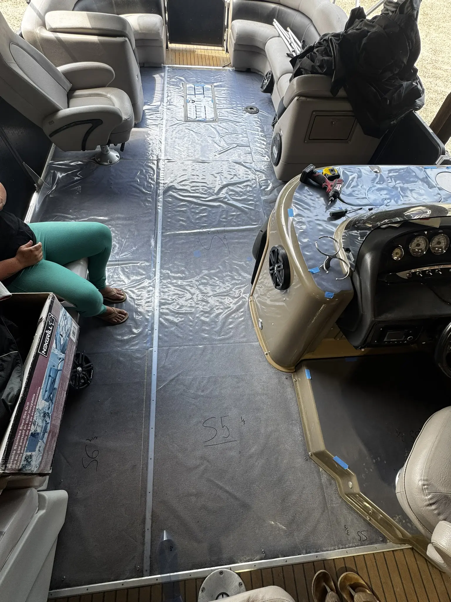 Interior of a boat with plastic covering.