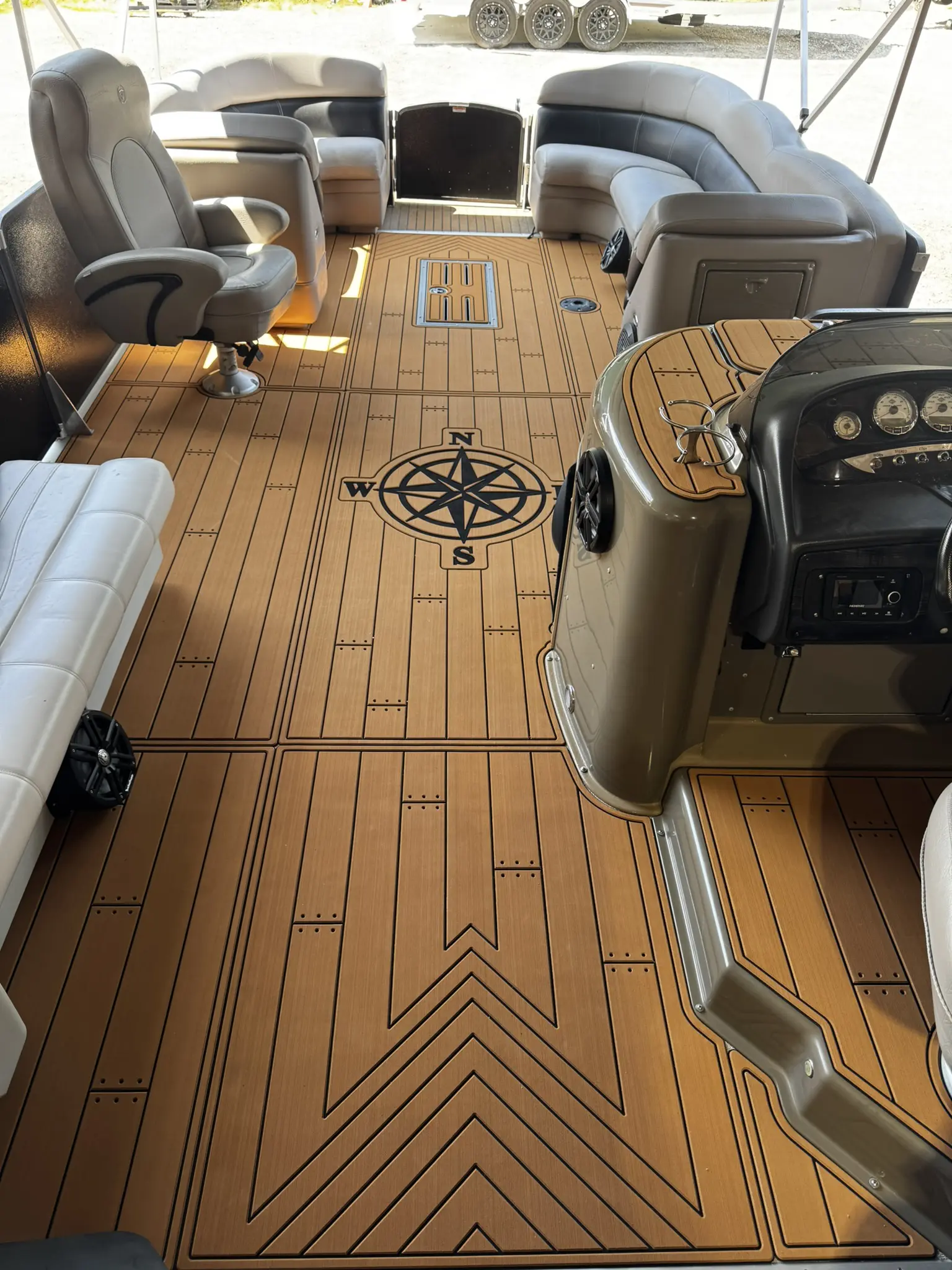 Pontoon boat interior with compass design floor.