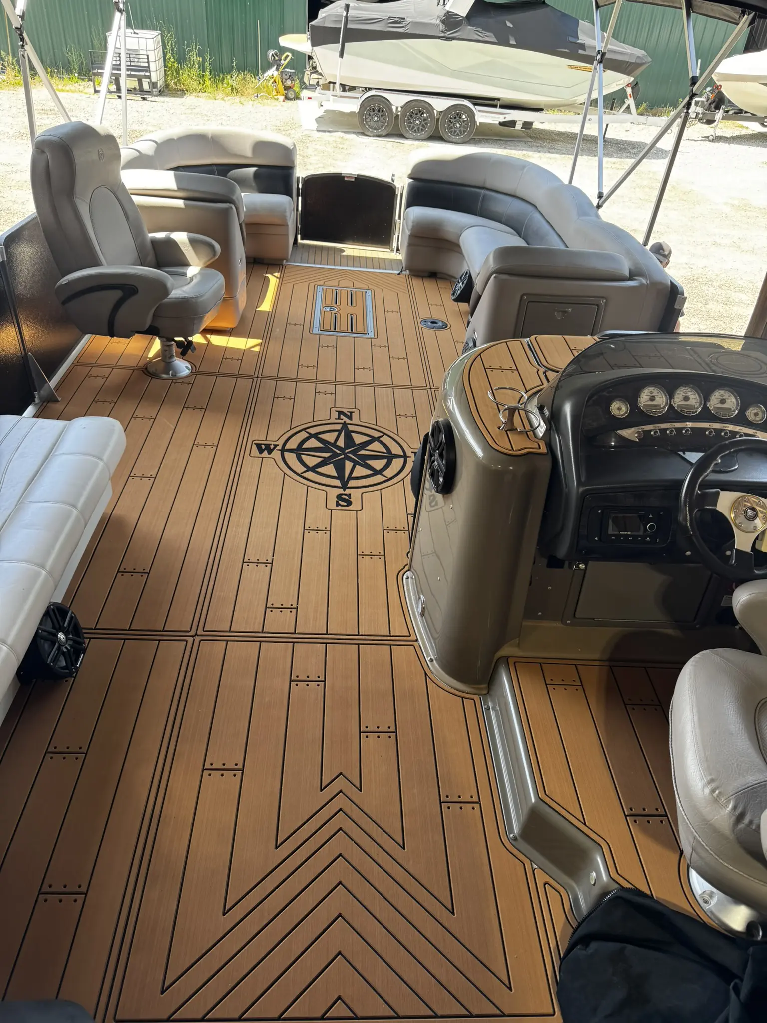 Pontoon boat interior with compass design flooring.