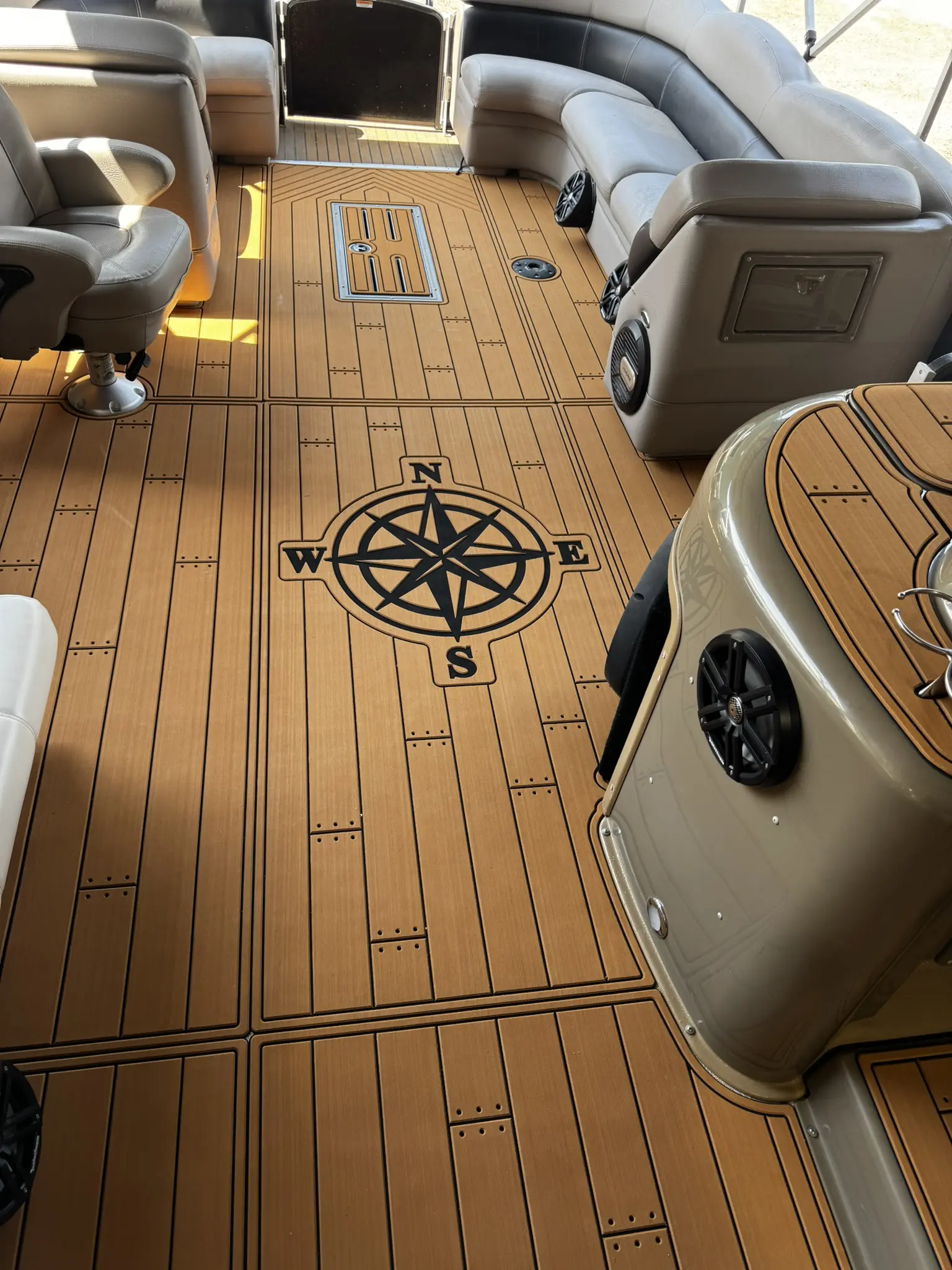 Boat interior with compass design on floor.