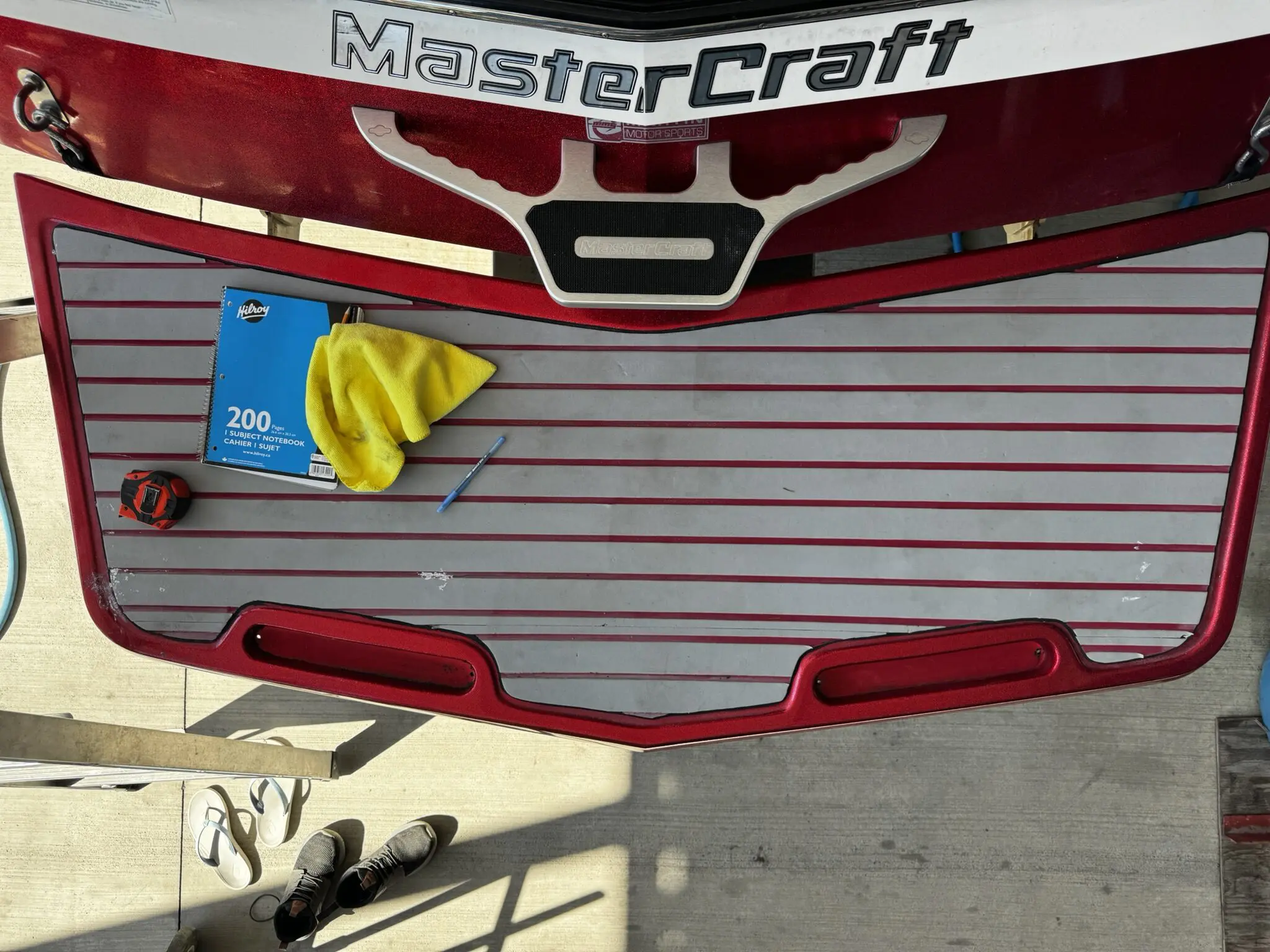 MasterCraft boat deck with cleaning supplies.