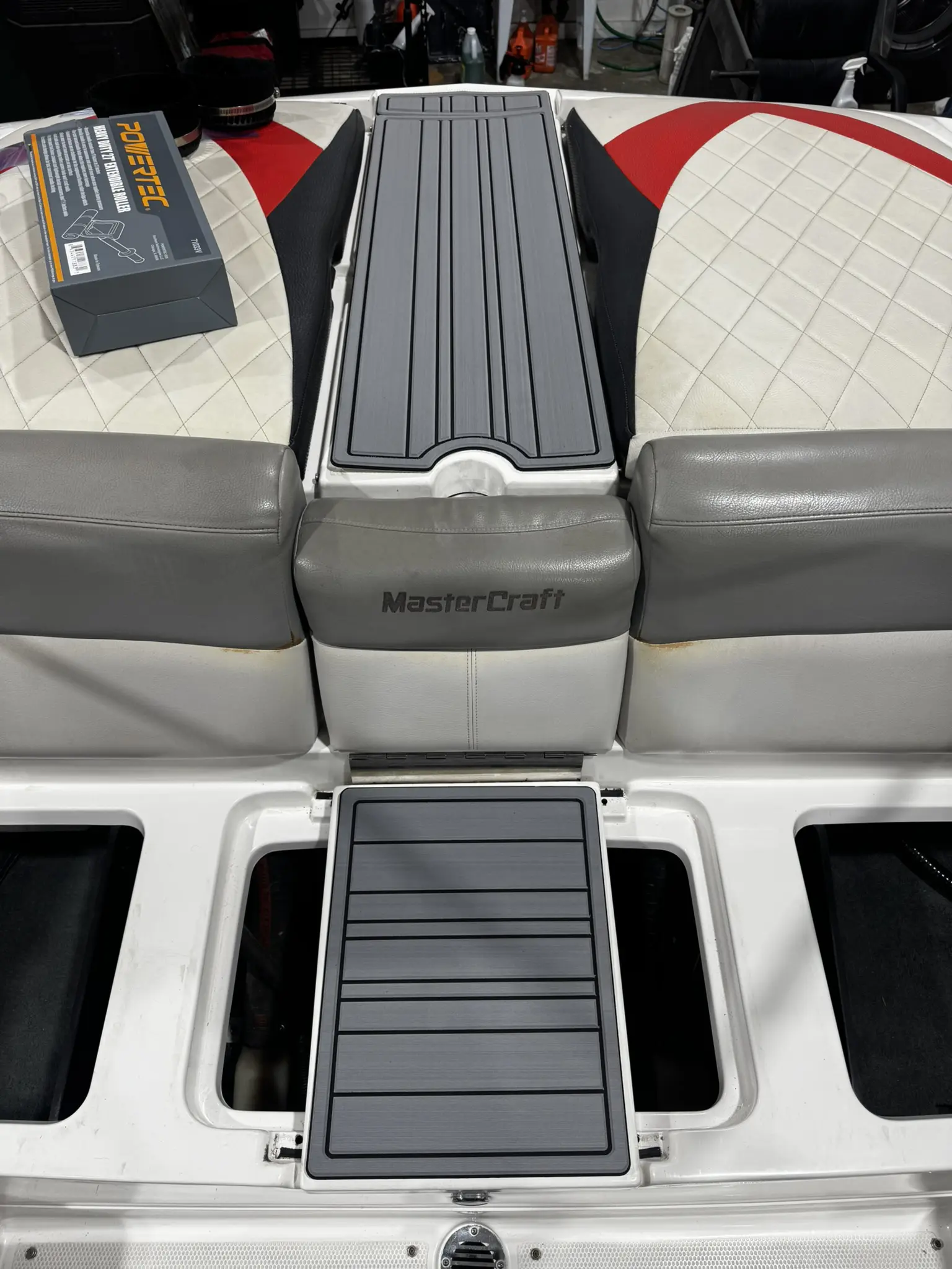 Boat seat with built-in storage compartments.
