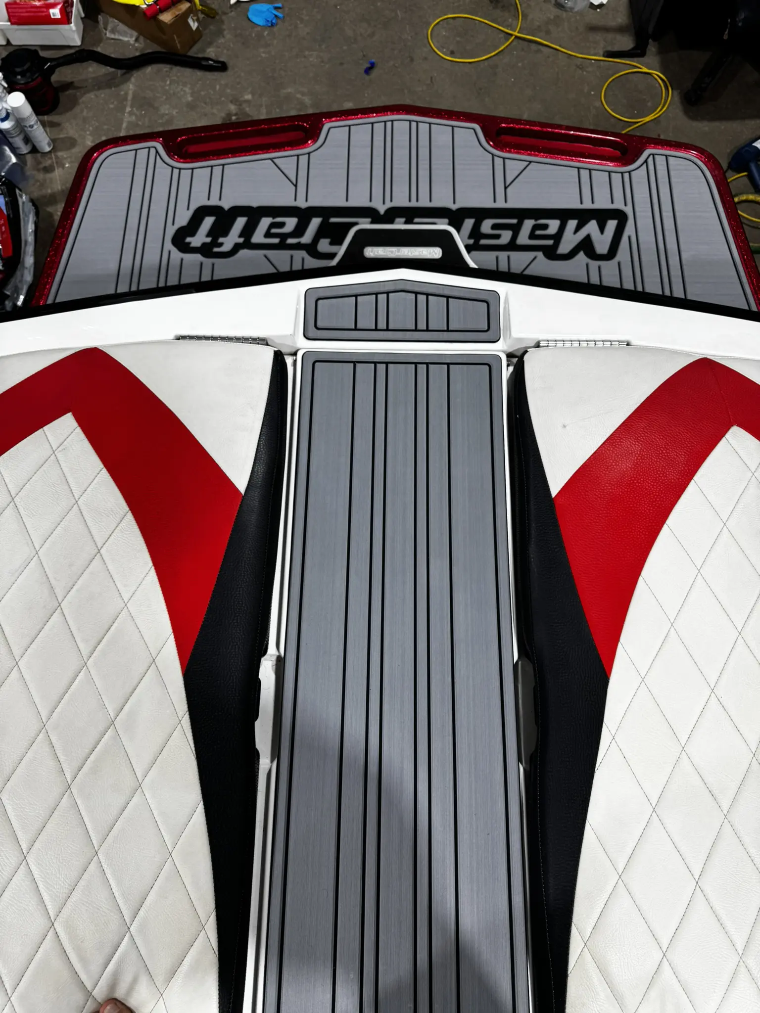 Boat deck with red and white design.