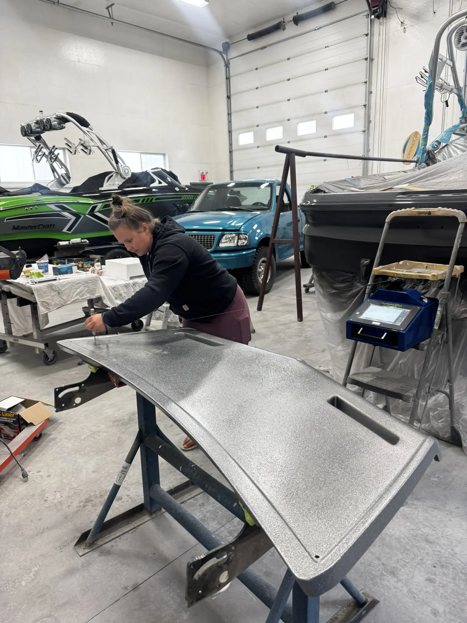 Person working in a boat workshop.