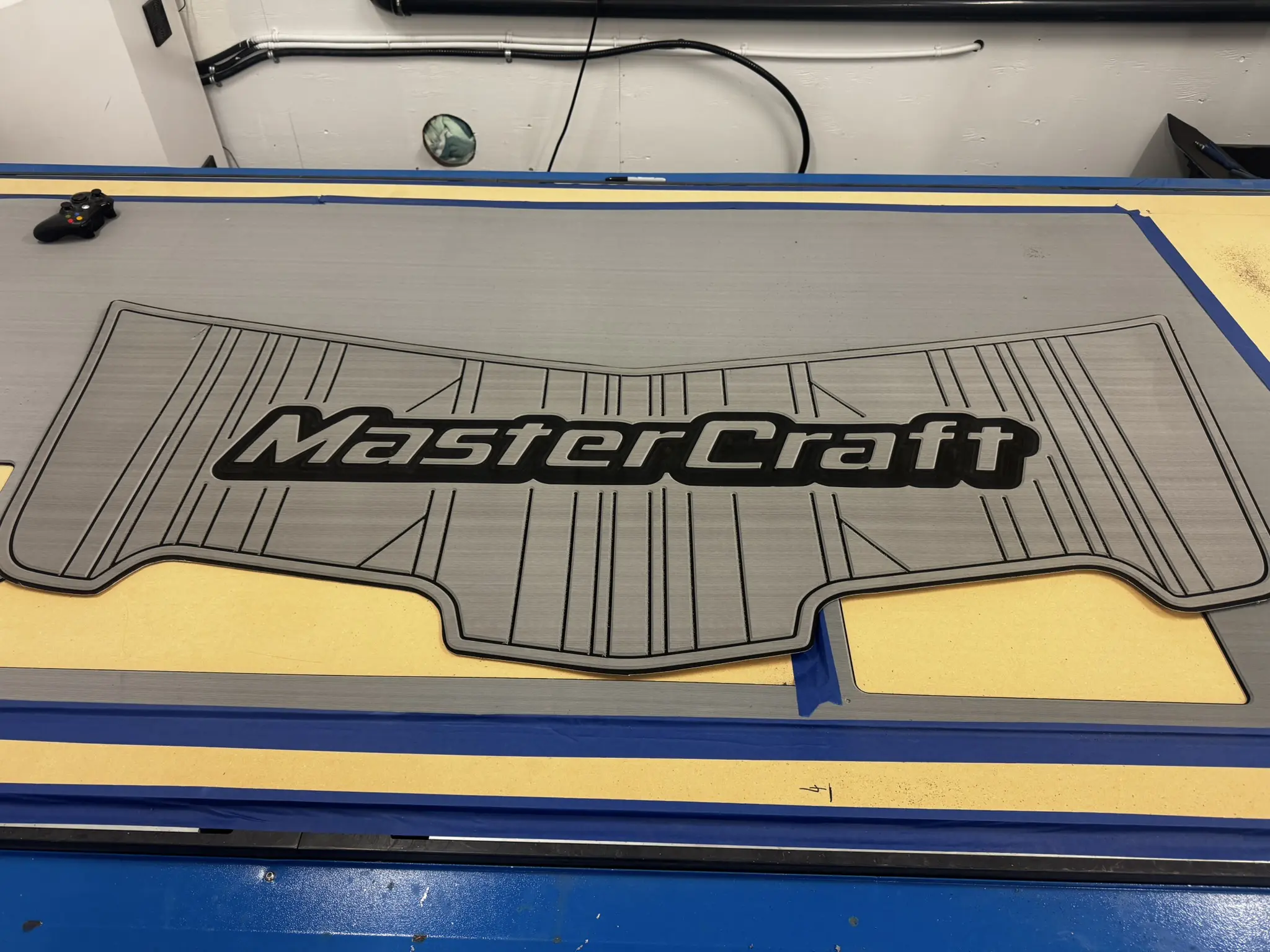 MasterCraft boat mat on a cutting table.