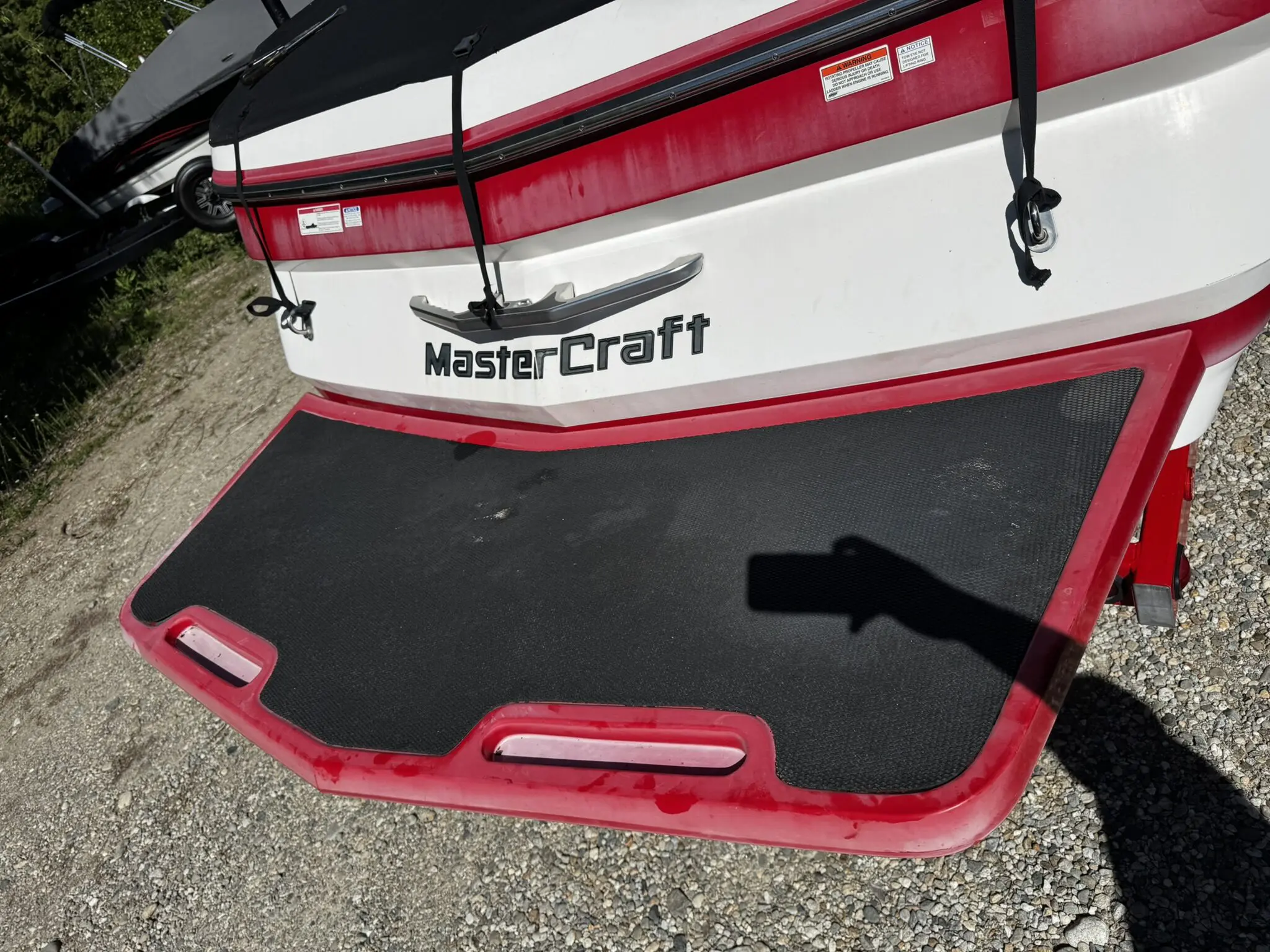 MasterCraft boat platform with red trim.