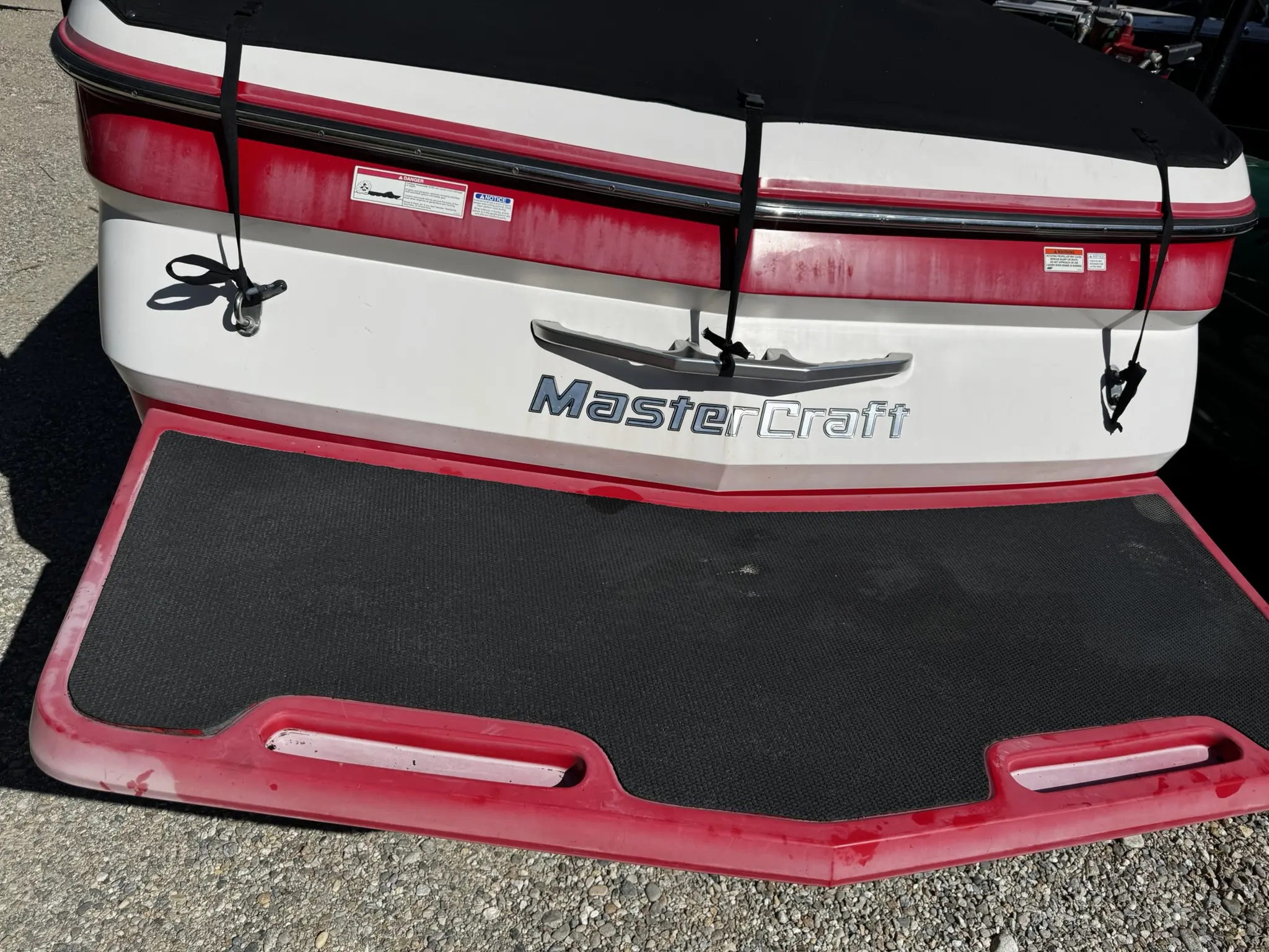 Boat stern with red and black accents.
